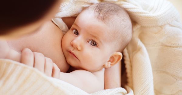 Mom cuddling baby