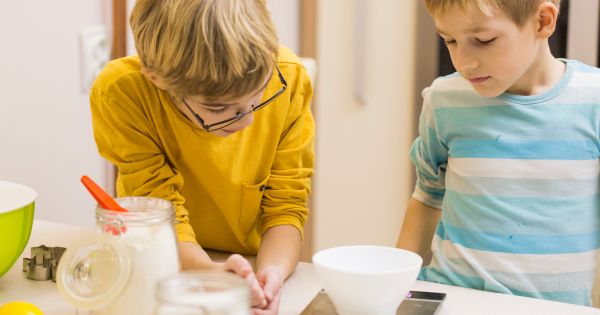 Boys measuring ingredients