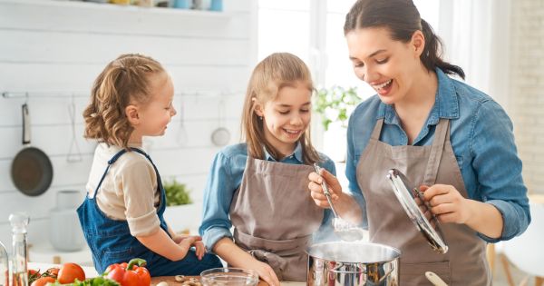 Mom and daughters cooking